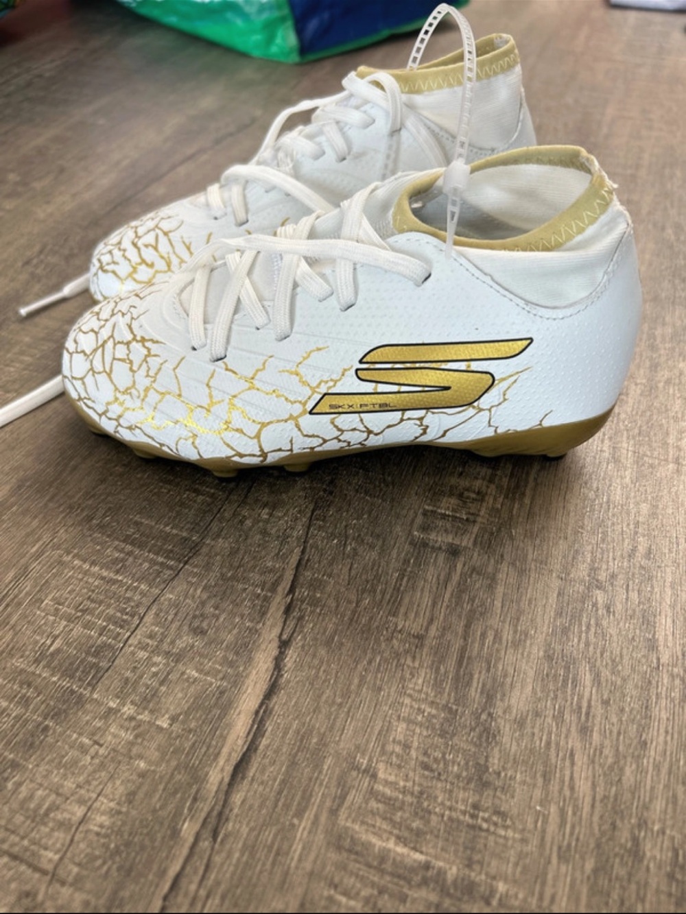 Skechers White and Gold Kids Soccer Cleats